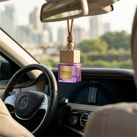 Hind Ki Fragrances car perfume hanging from a rearview mirror