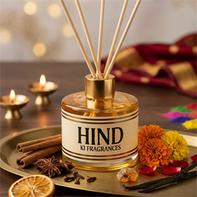Hind Ki Fragrances reed diffuser styled with candles and festive spices
